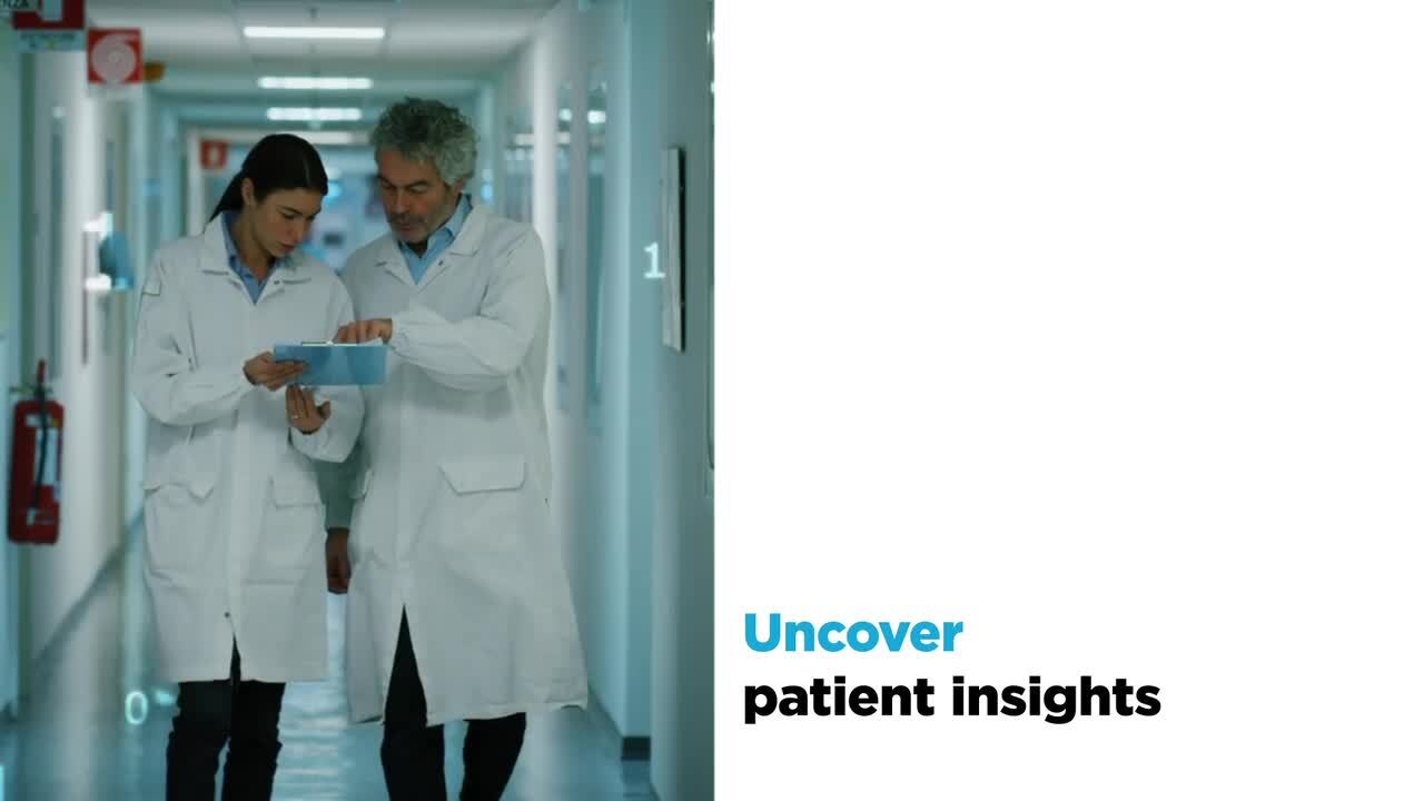 Two medical professionals looking at a clipboard next to white space with a text overlay for Uncover patient insights
